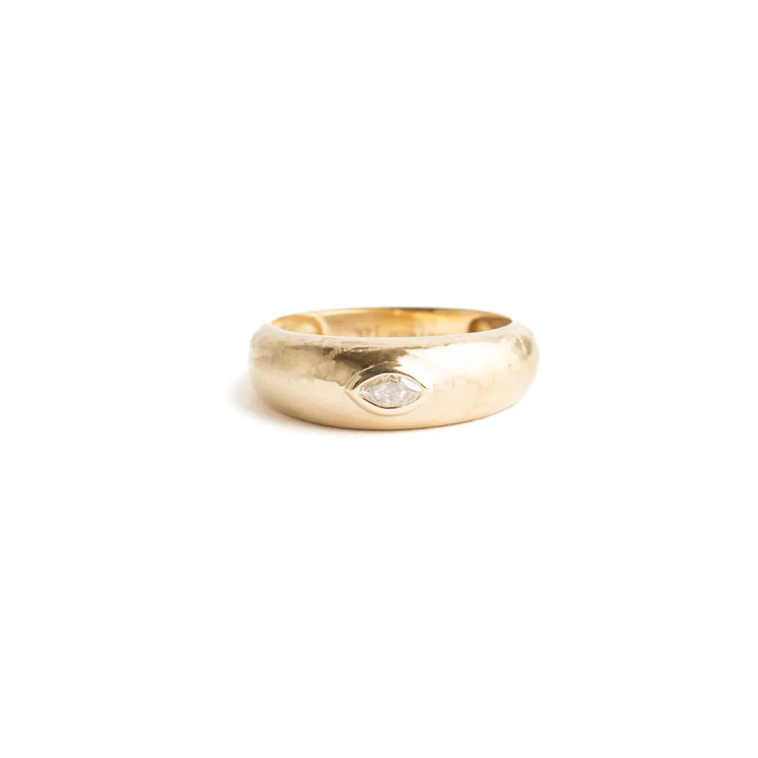 Domed gold band, marquise diamond
