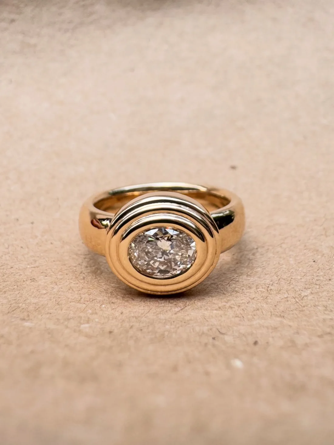 Gold signet ring with oval diamond