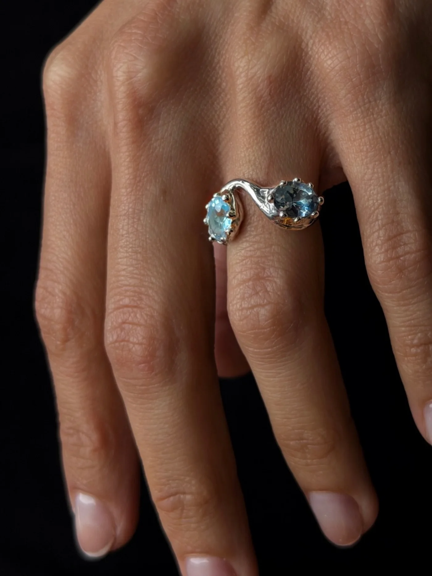 Toi et moi ring with two blue stones, worn