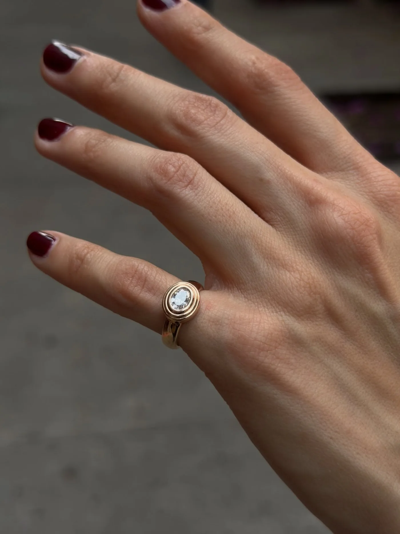 Gold signet ring with diamond, worn