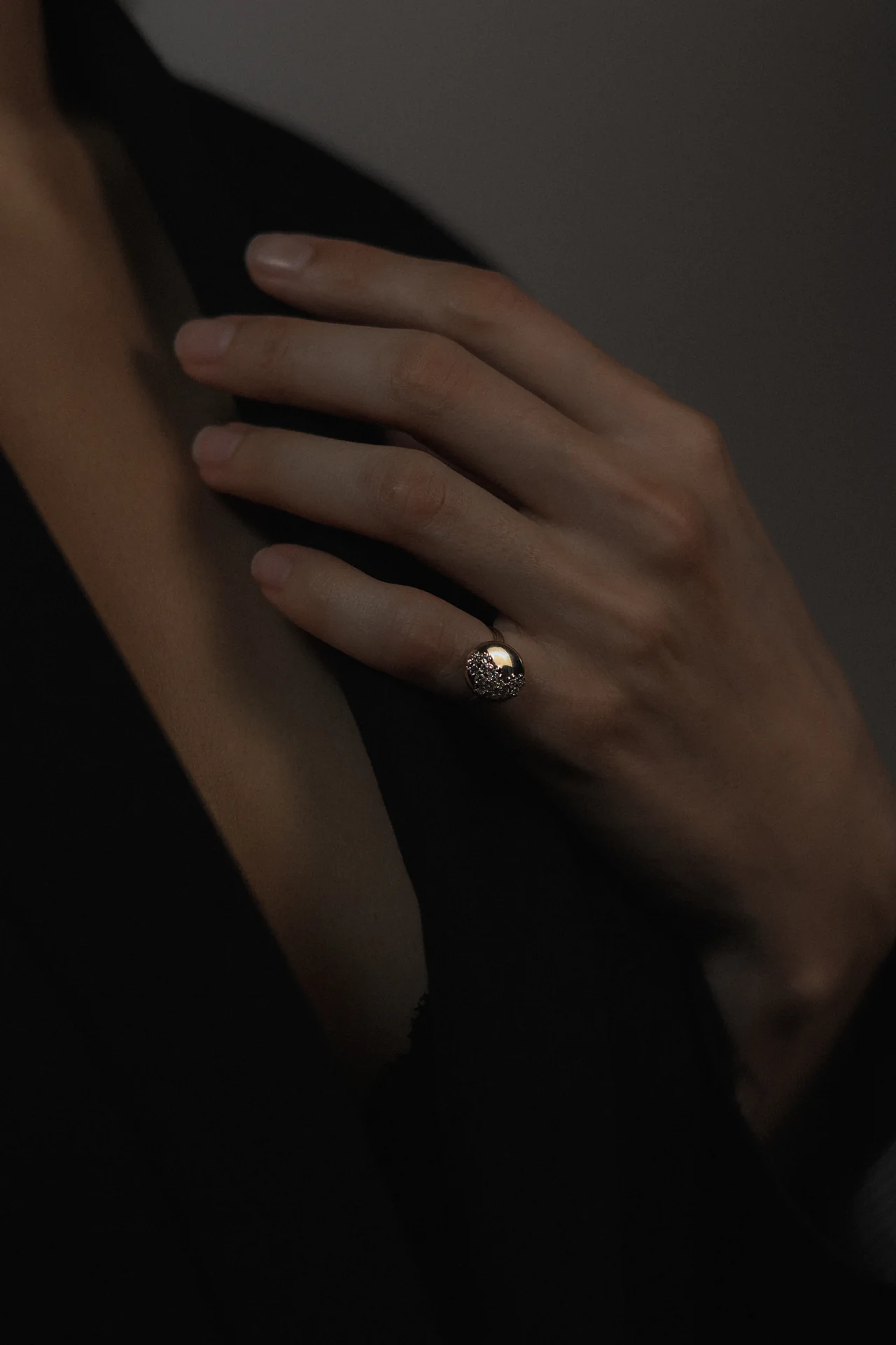 Hand wearing a sculptural textured ring